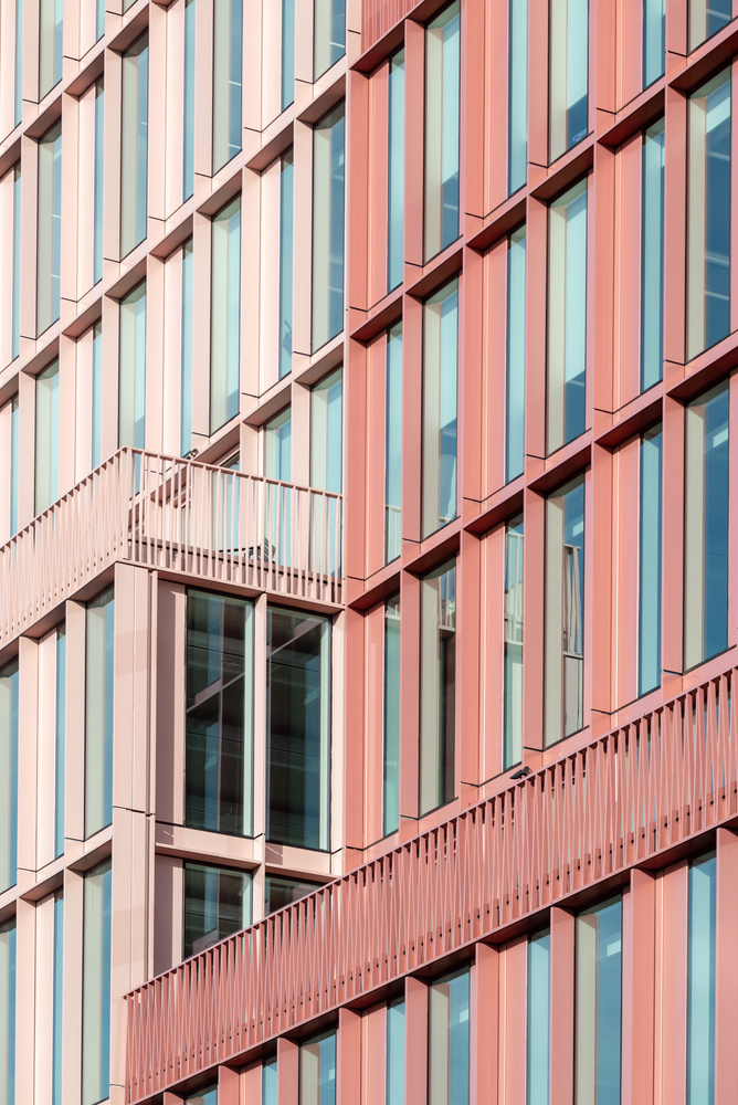 Close-up of geometric patterns and vibrant panels on R7 building facade.